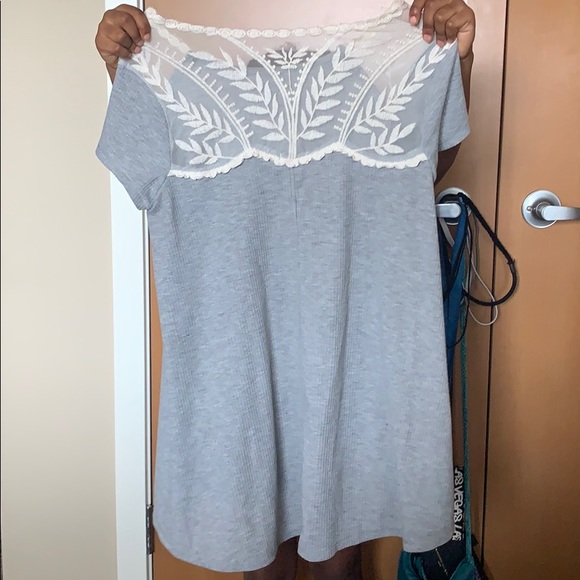 A gray blouse with a white flower design. - Picture 2 of 2
